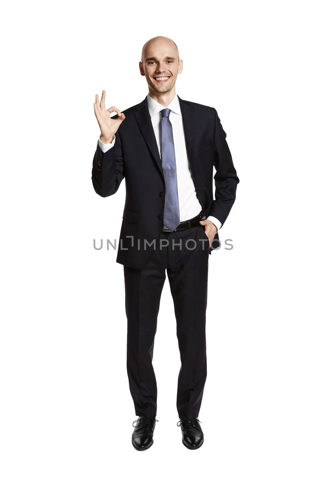 Full lenght studio shot of a satisfied man isolated on white background.