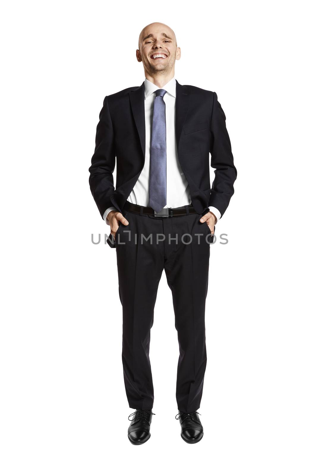 Full lenght portrait of laughing young businessman on white background.