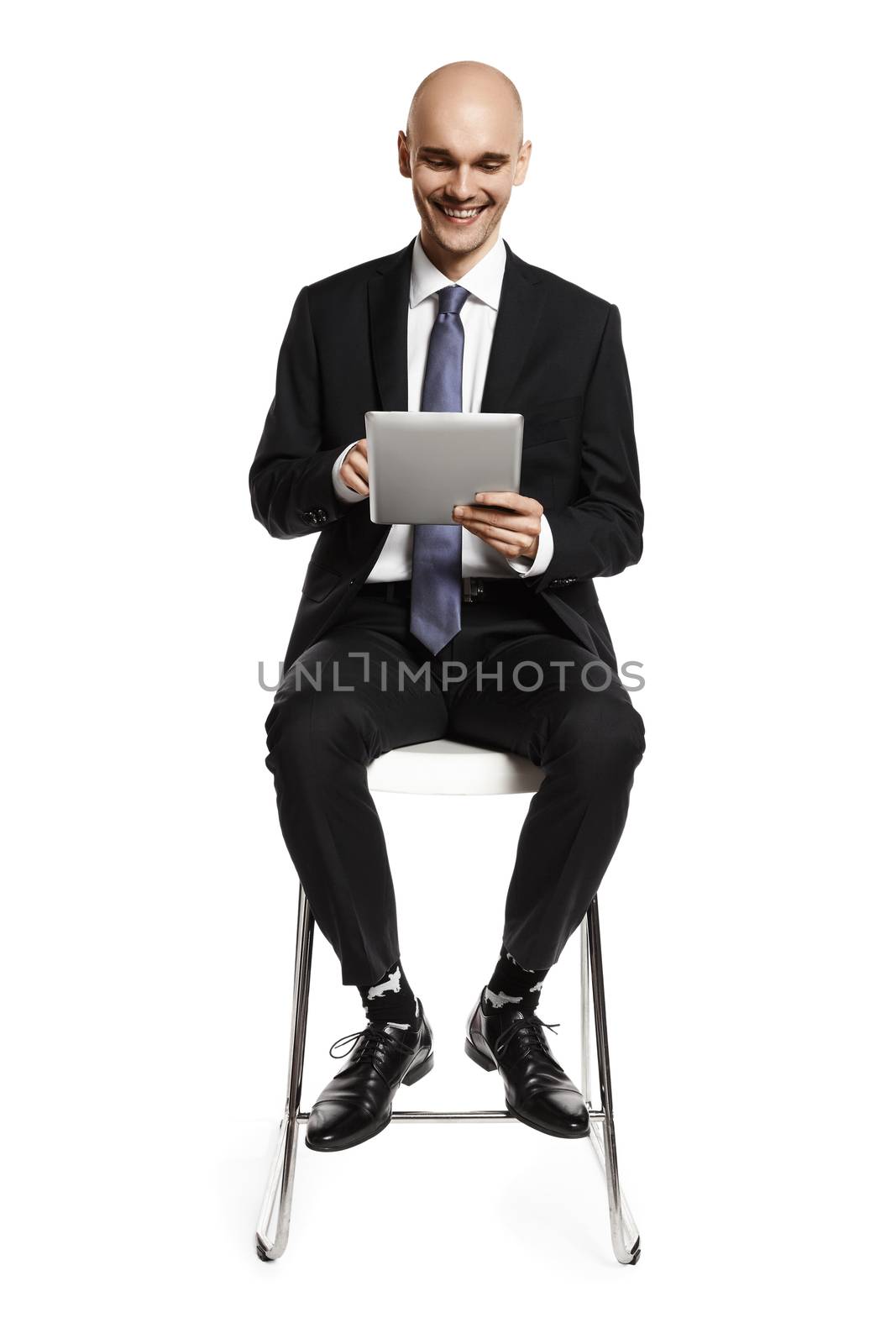Businessman Looking at Digital Tablet by filipw