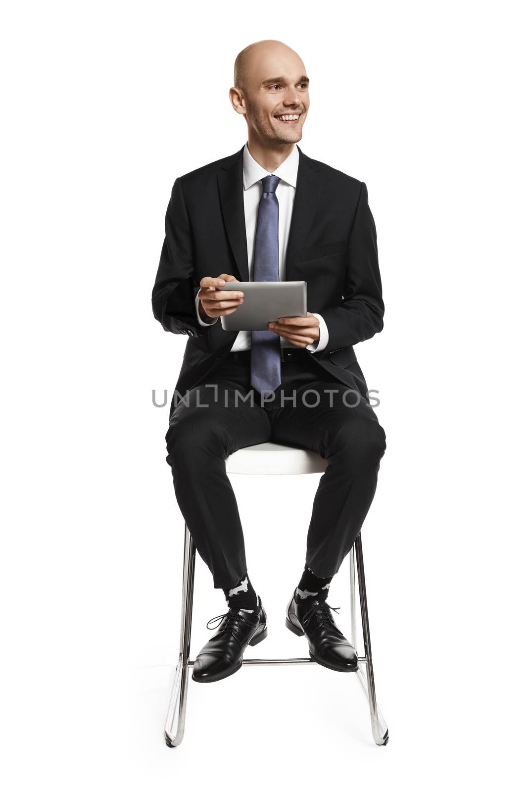 Young businessman with digital tablet by filipw
