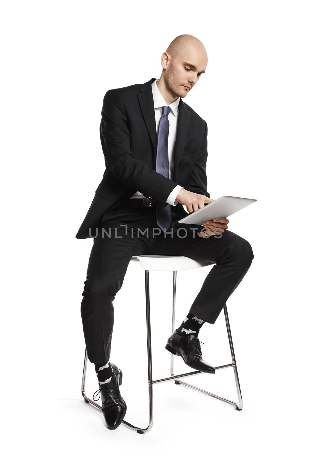 Businessman Working on the Digital Tablet by filipw