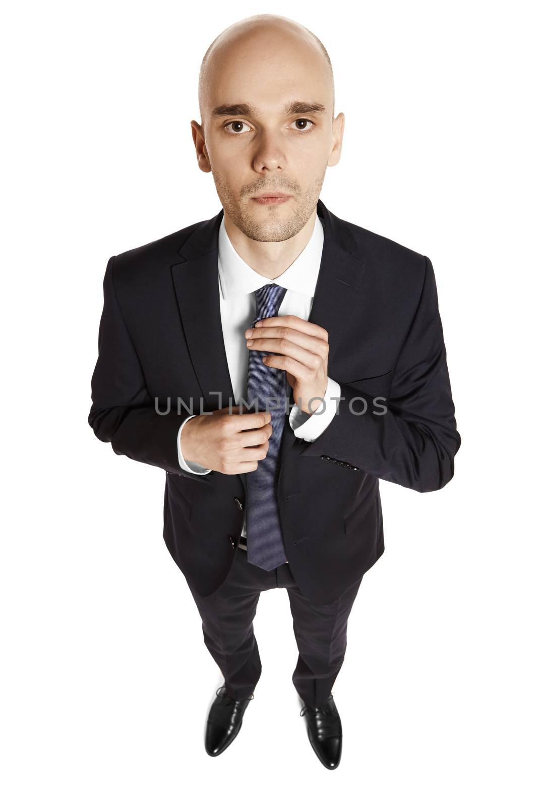 Overhead view of a young office worker getting ready . Portrait isolated on white background.