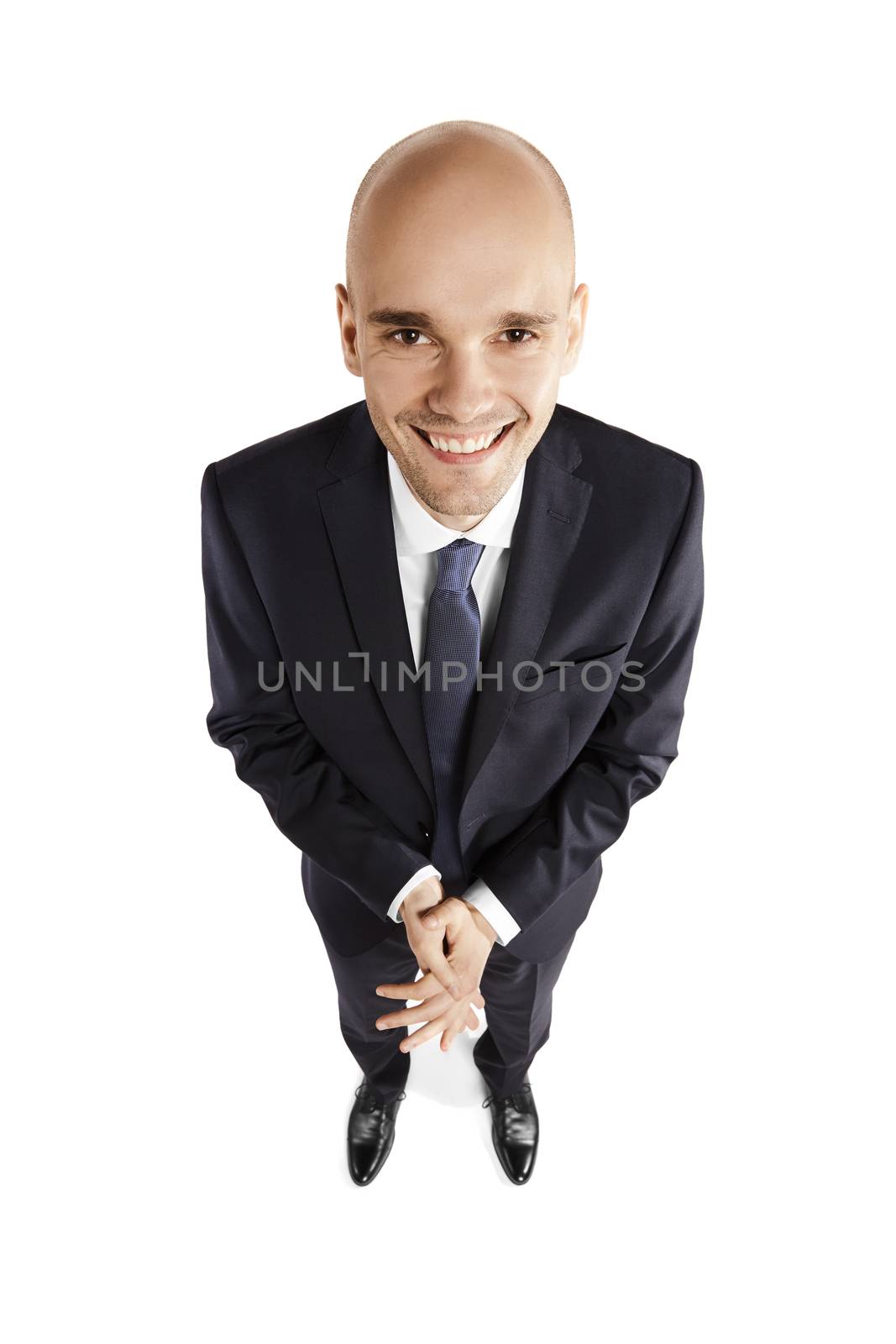Overhead view of a satisfied man. Portrait isolated on white background.