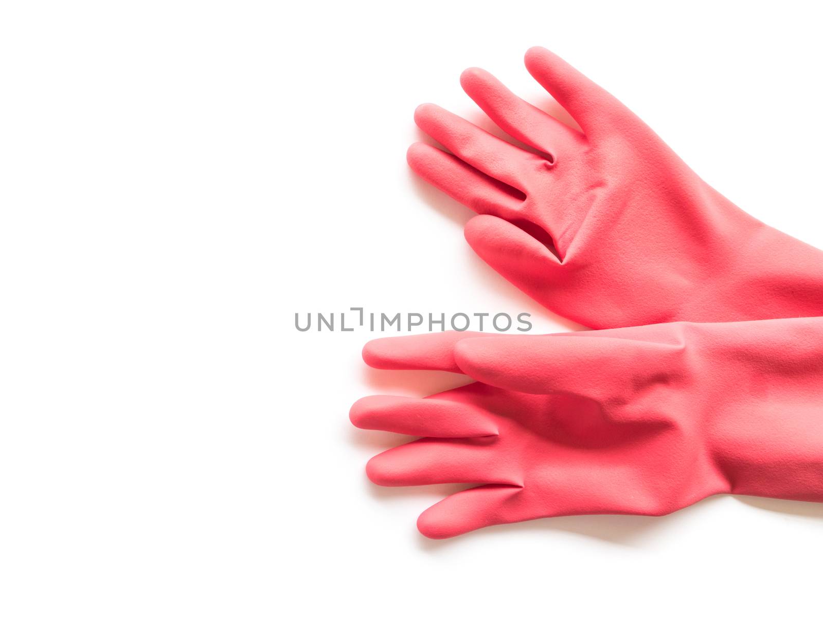 Closeup Red rubber gloves for cleaning on white background, workhouse concept