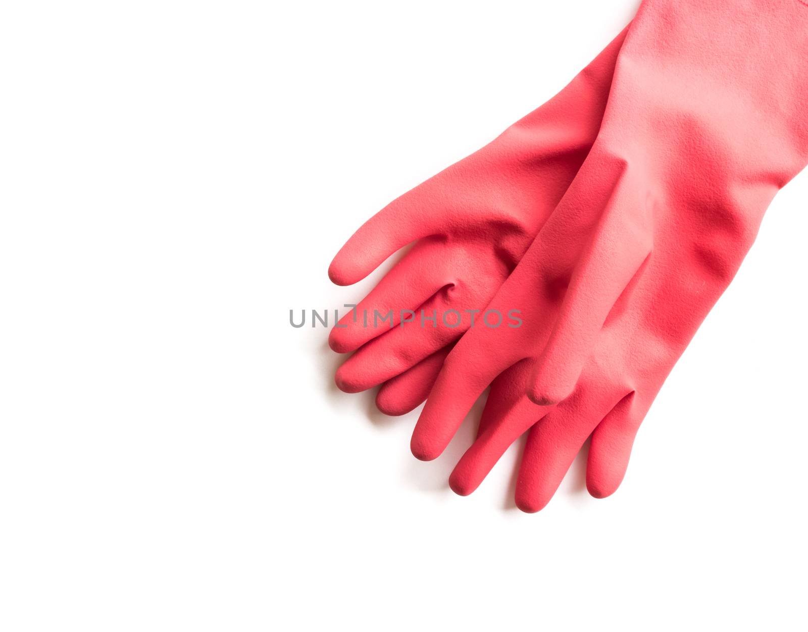 Closeup Red rubber gloves for cleaning on white background, workhouse concept