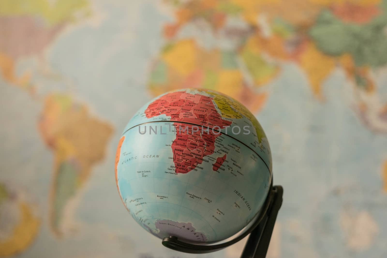 Africa map on a globe with the whole world as background