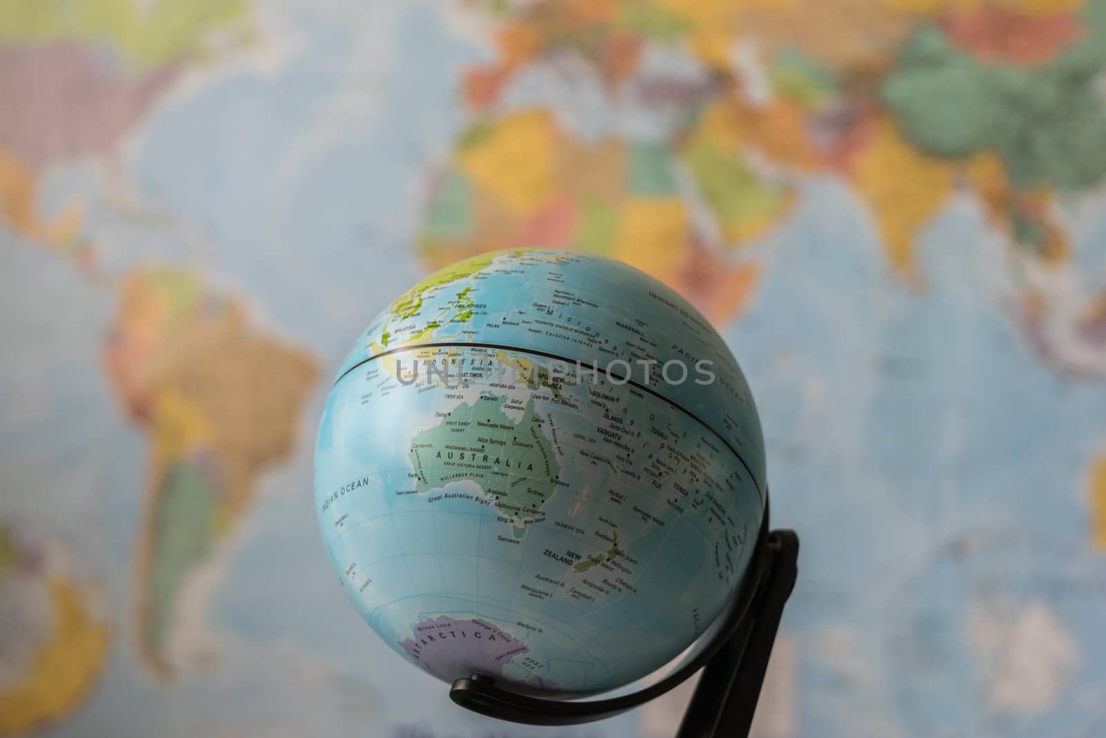 Australia map on a globe with the whole world as background
