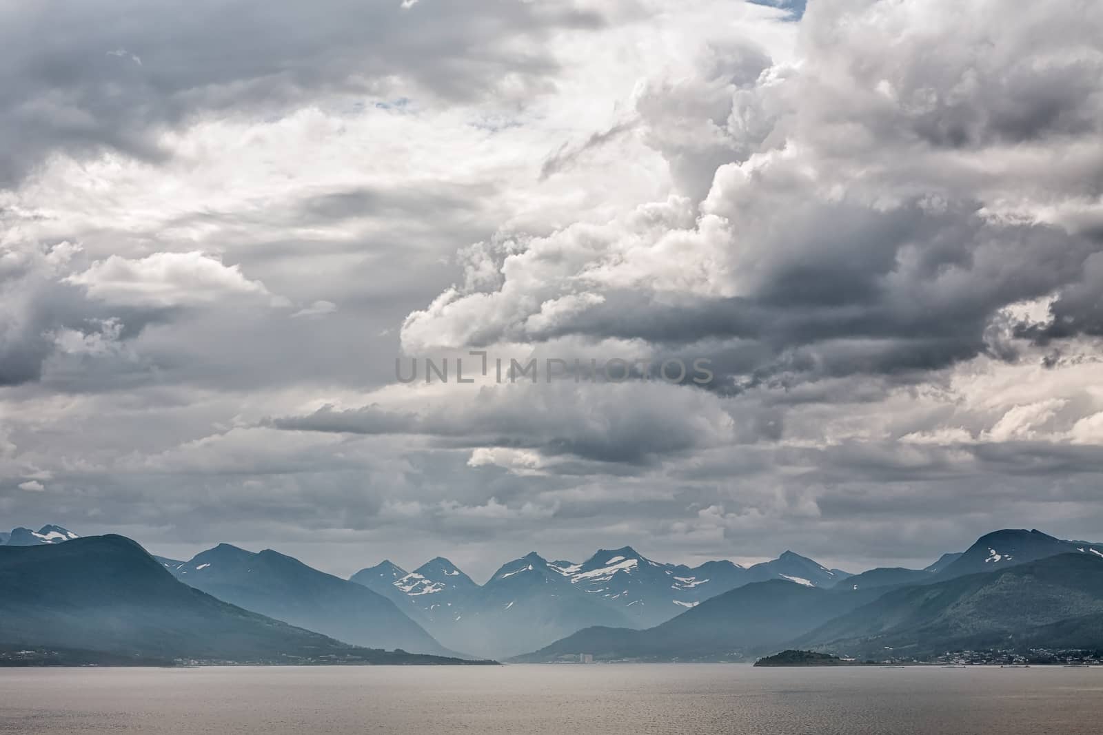 Mountains along the Romsdalsfjorden near Andalsnes under a cloudy sky, Norway