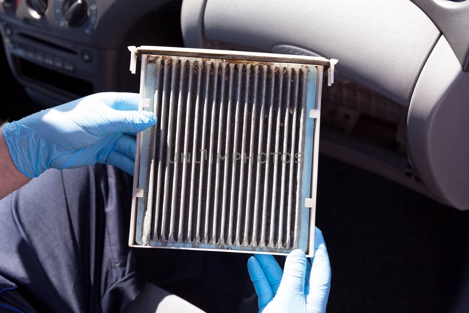 Replacing the old cabin air filter by wellphoto