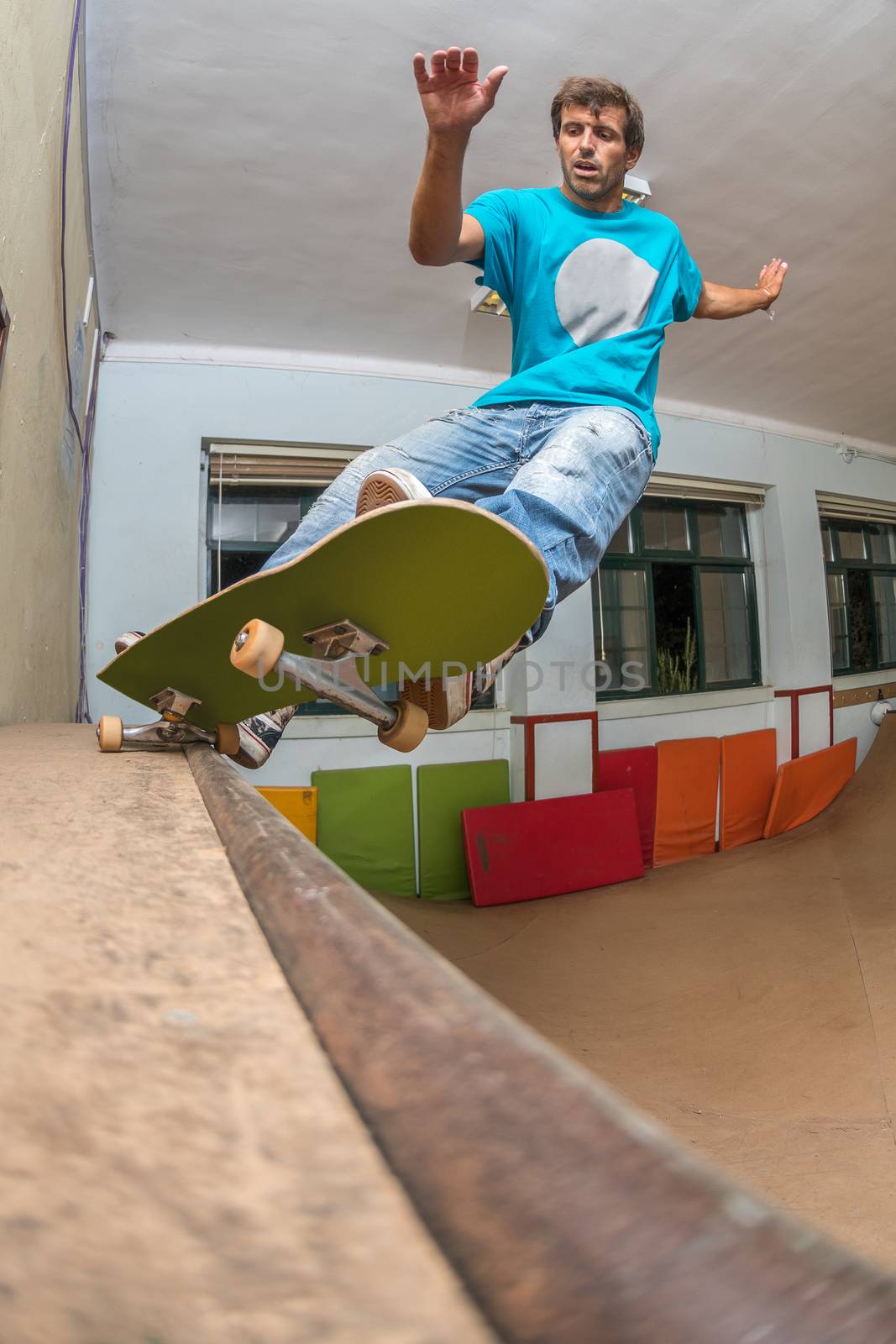 Skateboarder performing a pivot grind by homydesign