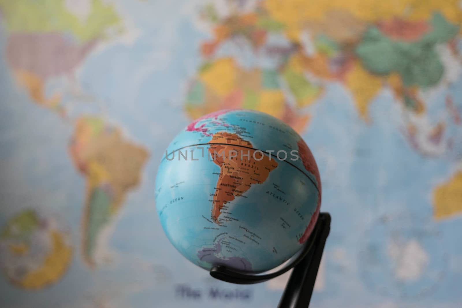 South America map on a globe with the whole world as background