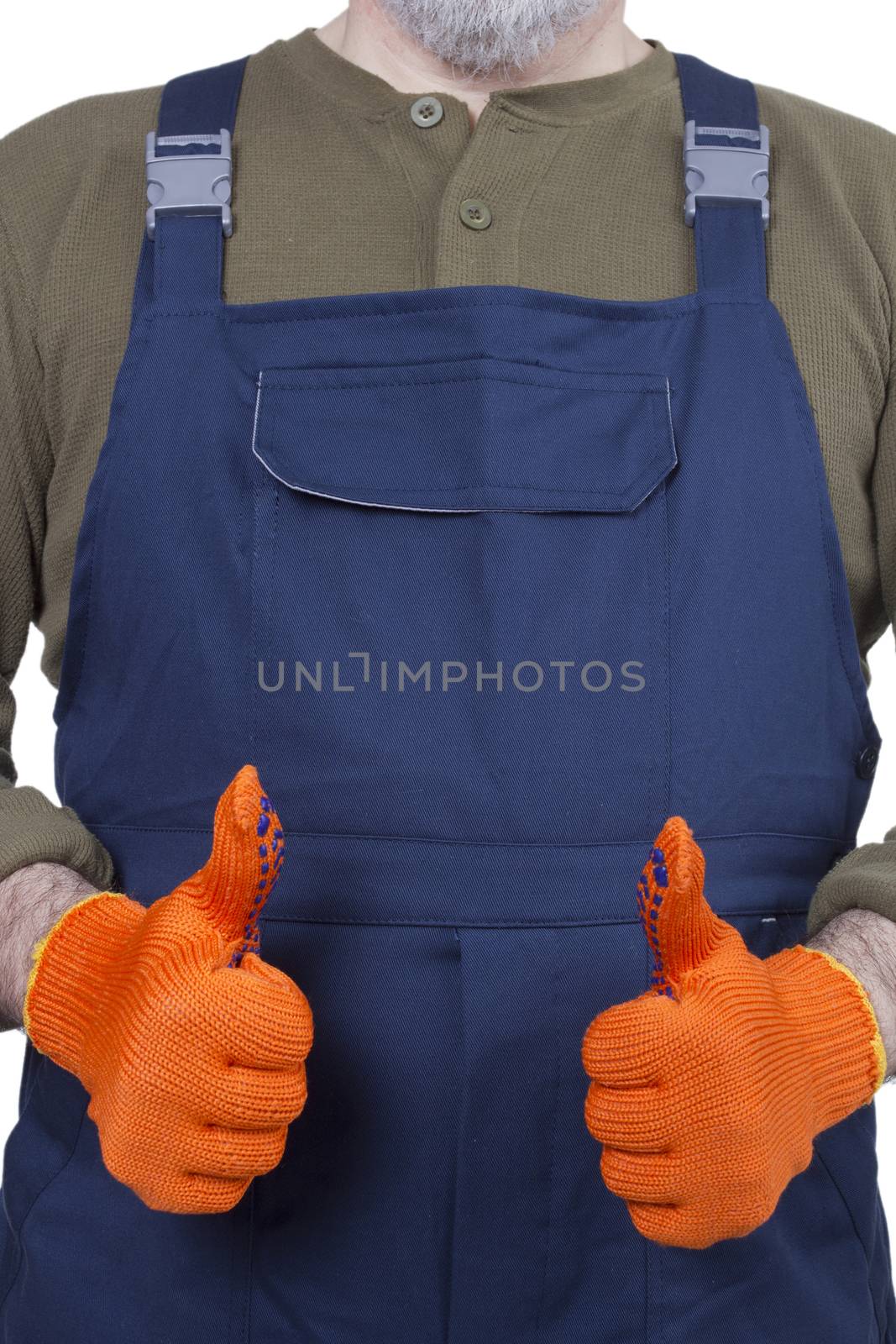 Hands of the worker in blue overalls, wearing orange gloves