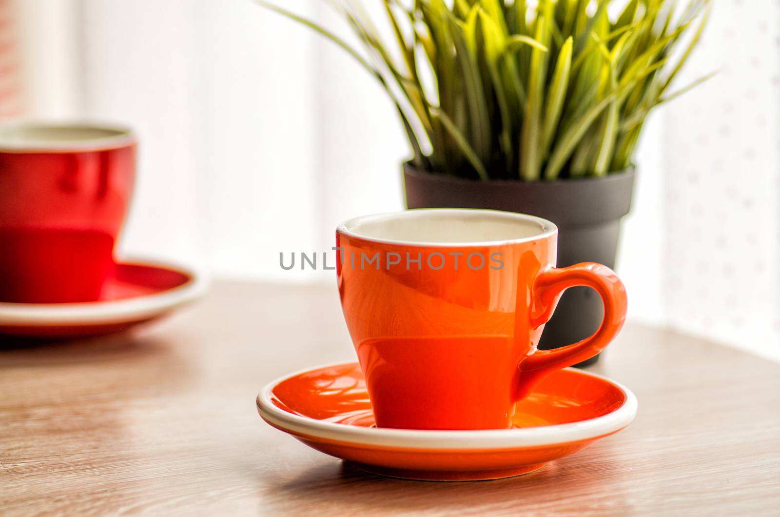 colorful tea cups on the wooden table