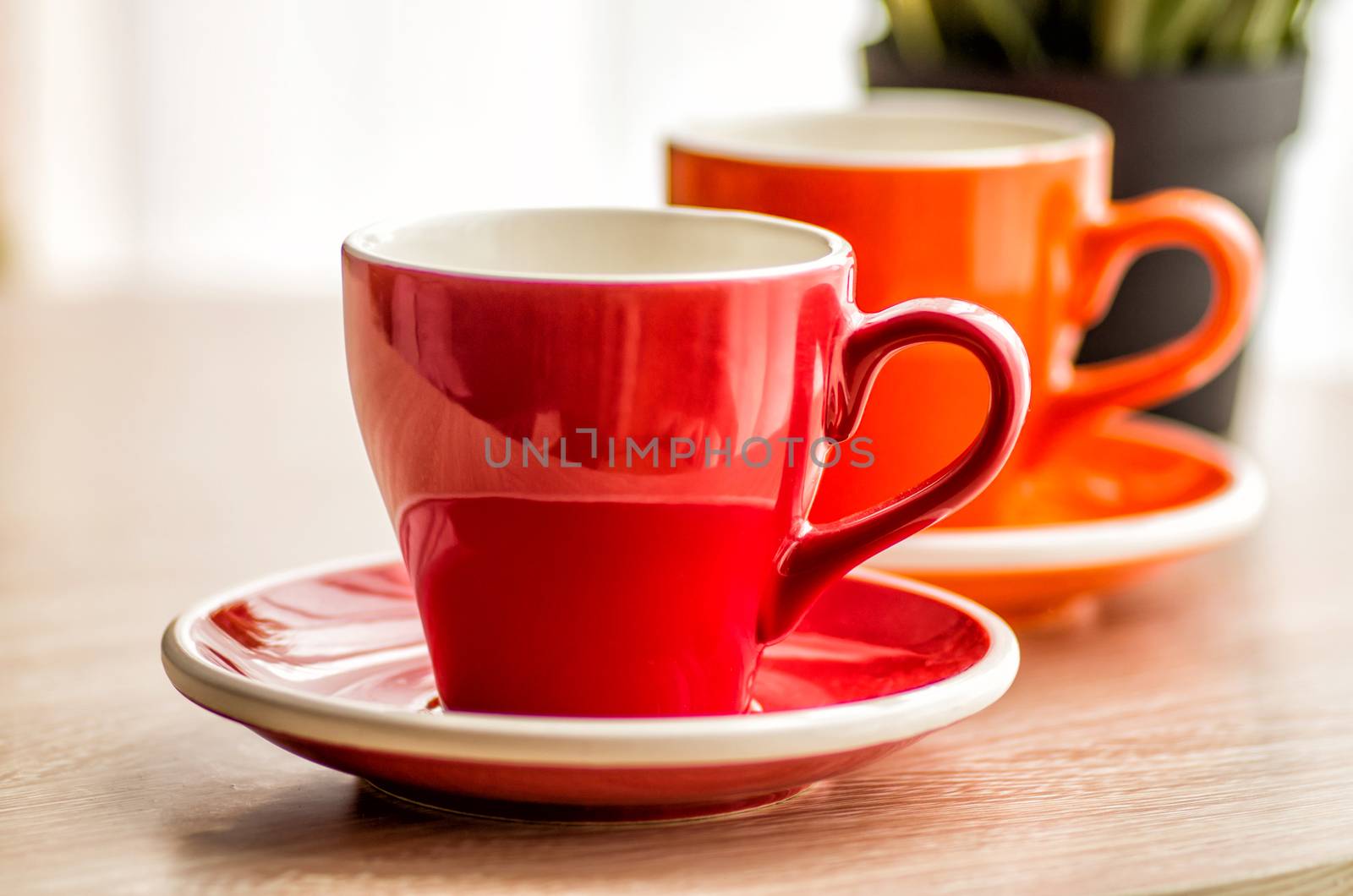 still life colorful tea cups on the wooden table by Desperada