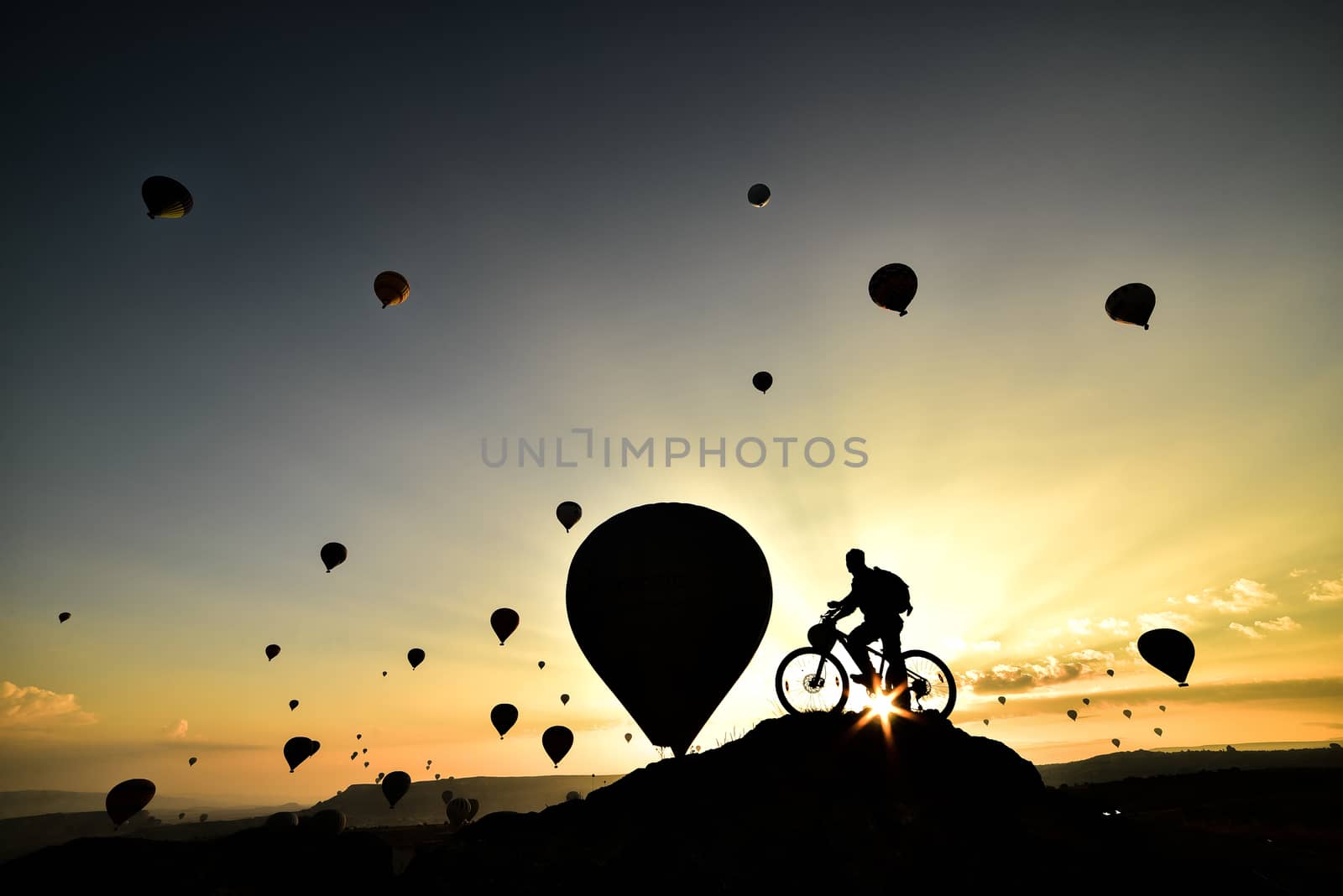 watch balloons in Cappadocia on a bicycle