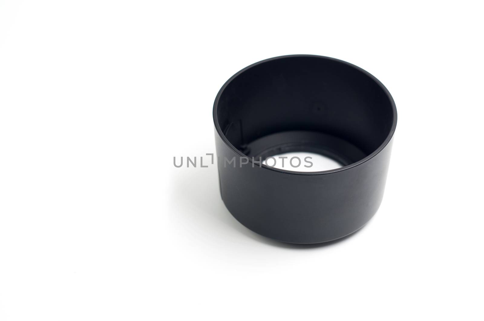 black camera lens hood on the white background