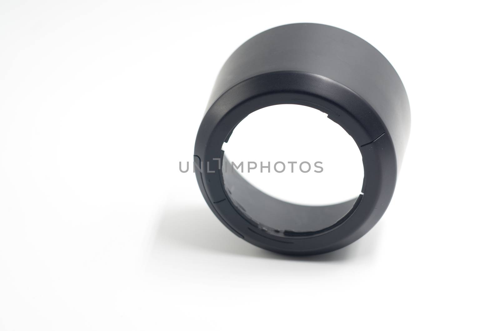 black camera lens hood on the white background