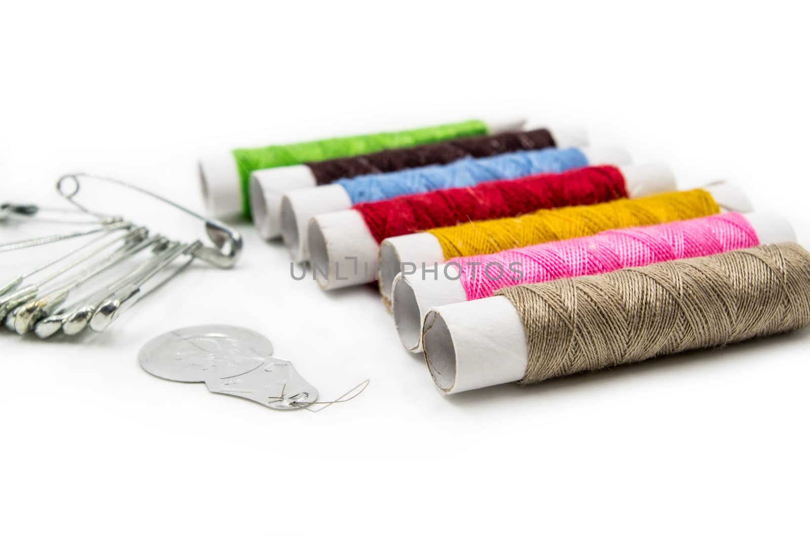 sewing tools and pins on the white background