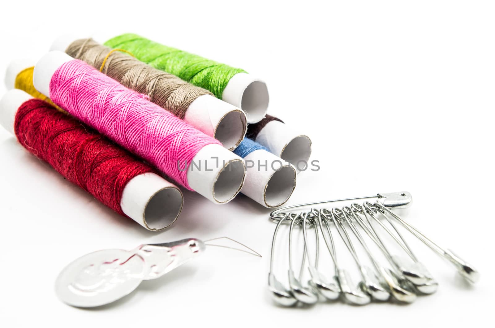 sewing tools and pins on the white background