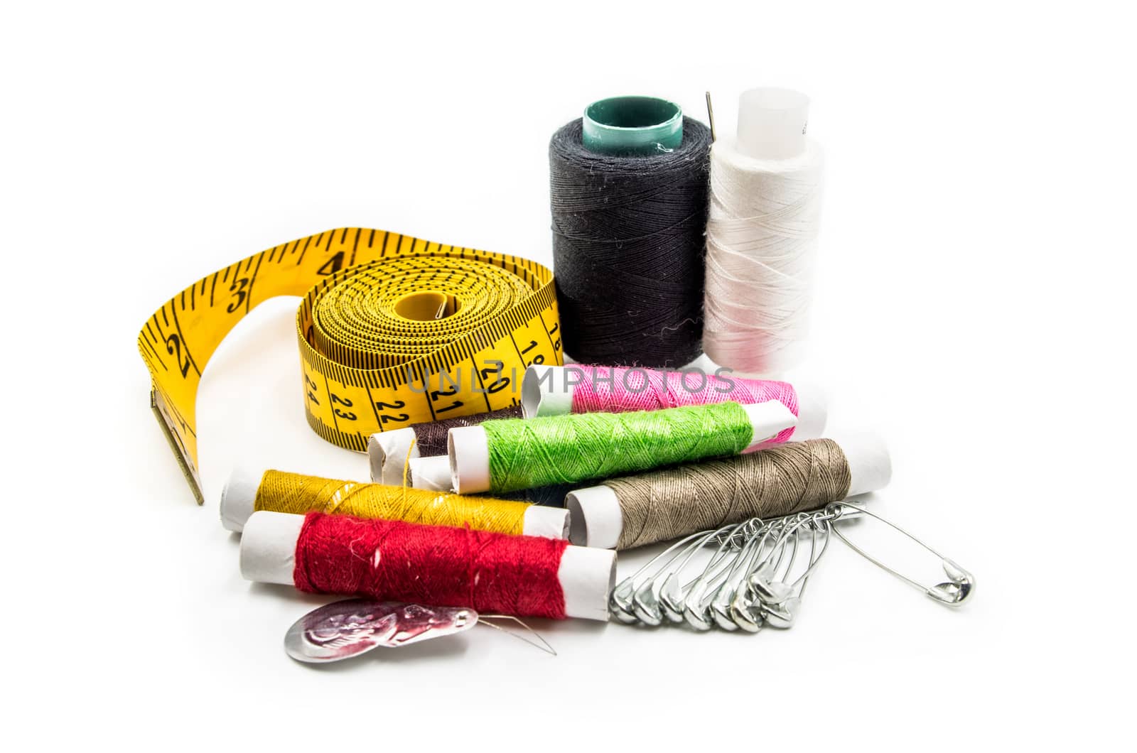 sewing tools and pins on the white background