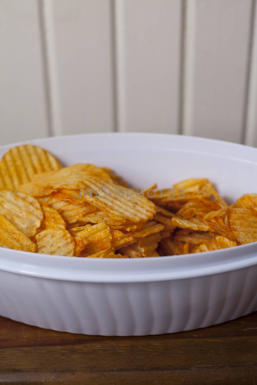 Close up of a bowl of flavored potato chips