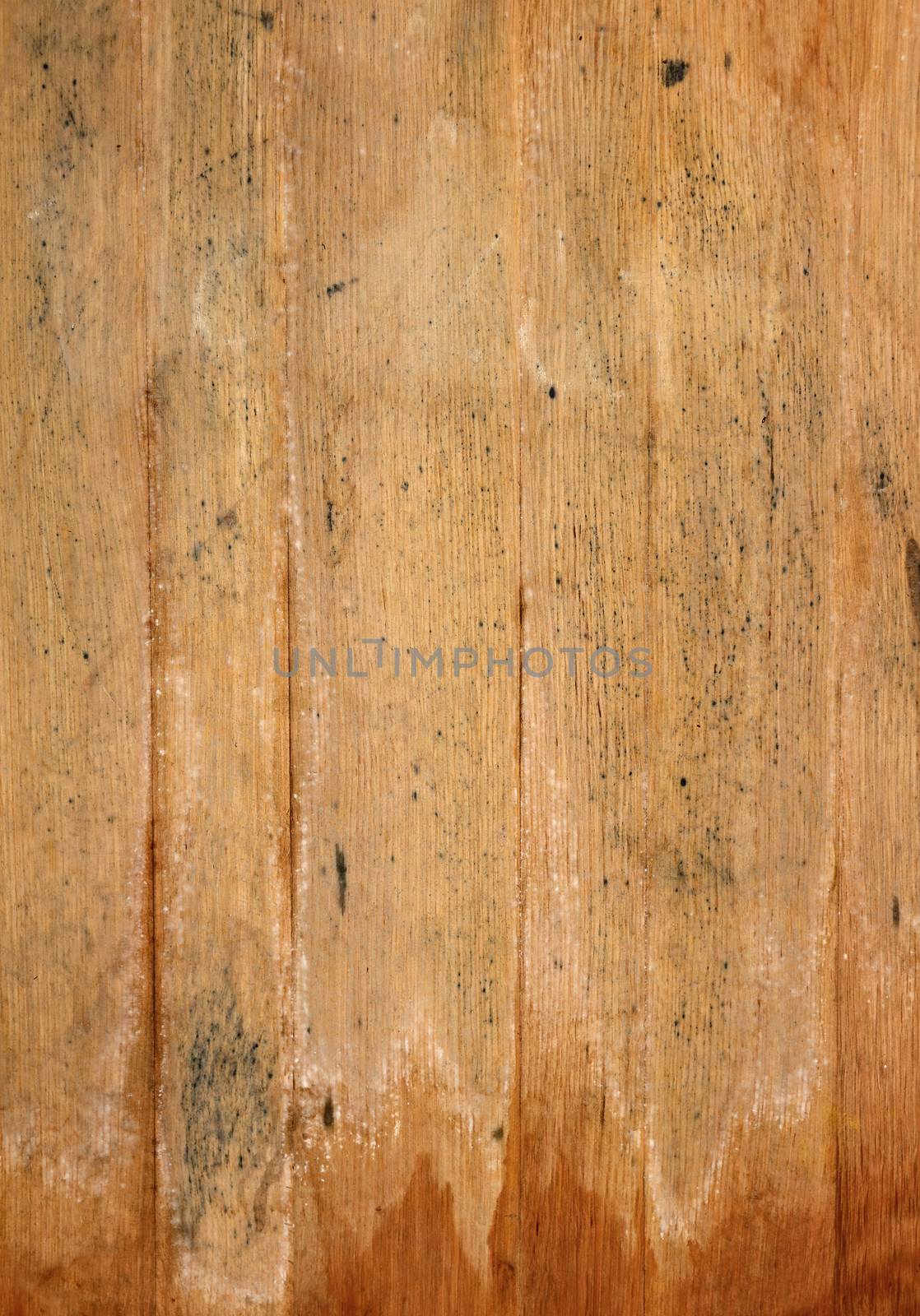 Vintage brown barrel wooden vertical planks background texture with scratches and black stains over wood grain of old aged oak barrel bottom, close up