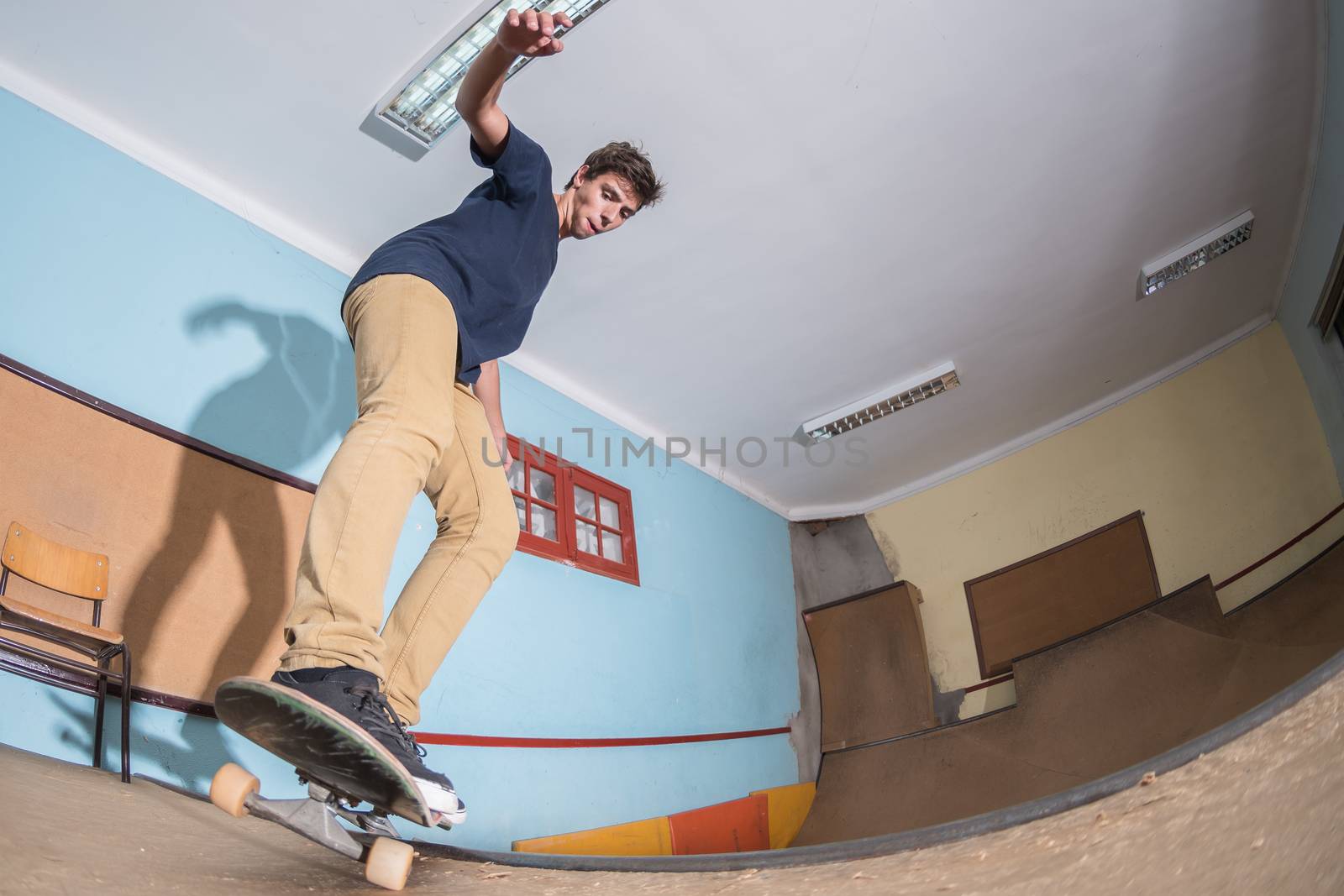 Skateboarder performing a trick by homydesign