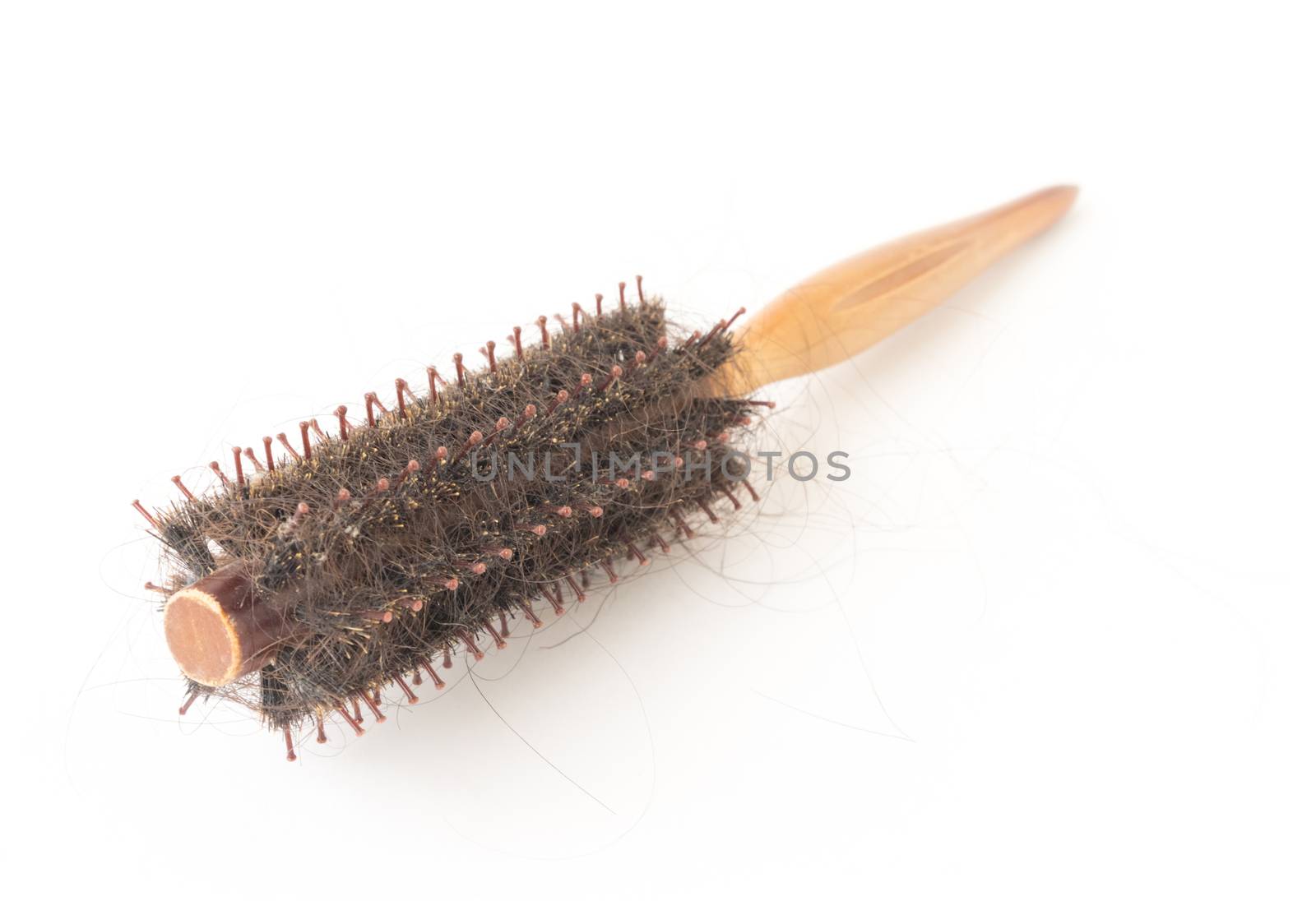 Comb brush with hair loss problem on white background, health care and medical concept