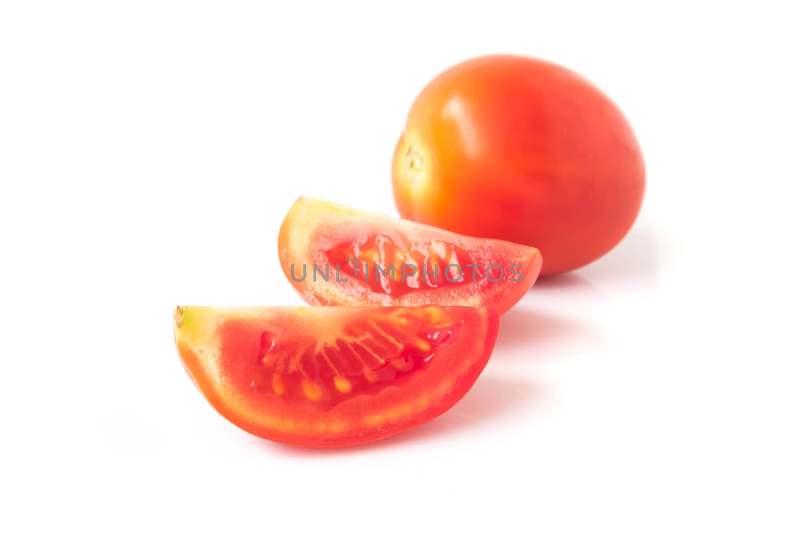Fresh tomatoe slices on white background, selective focus by pt.pongsak@gmail.com
