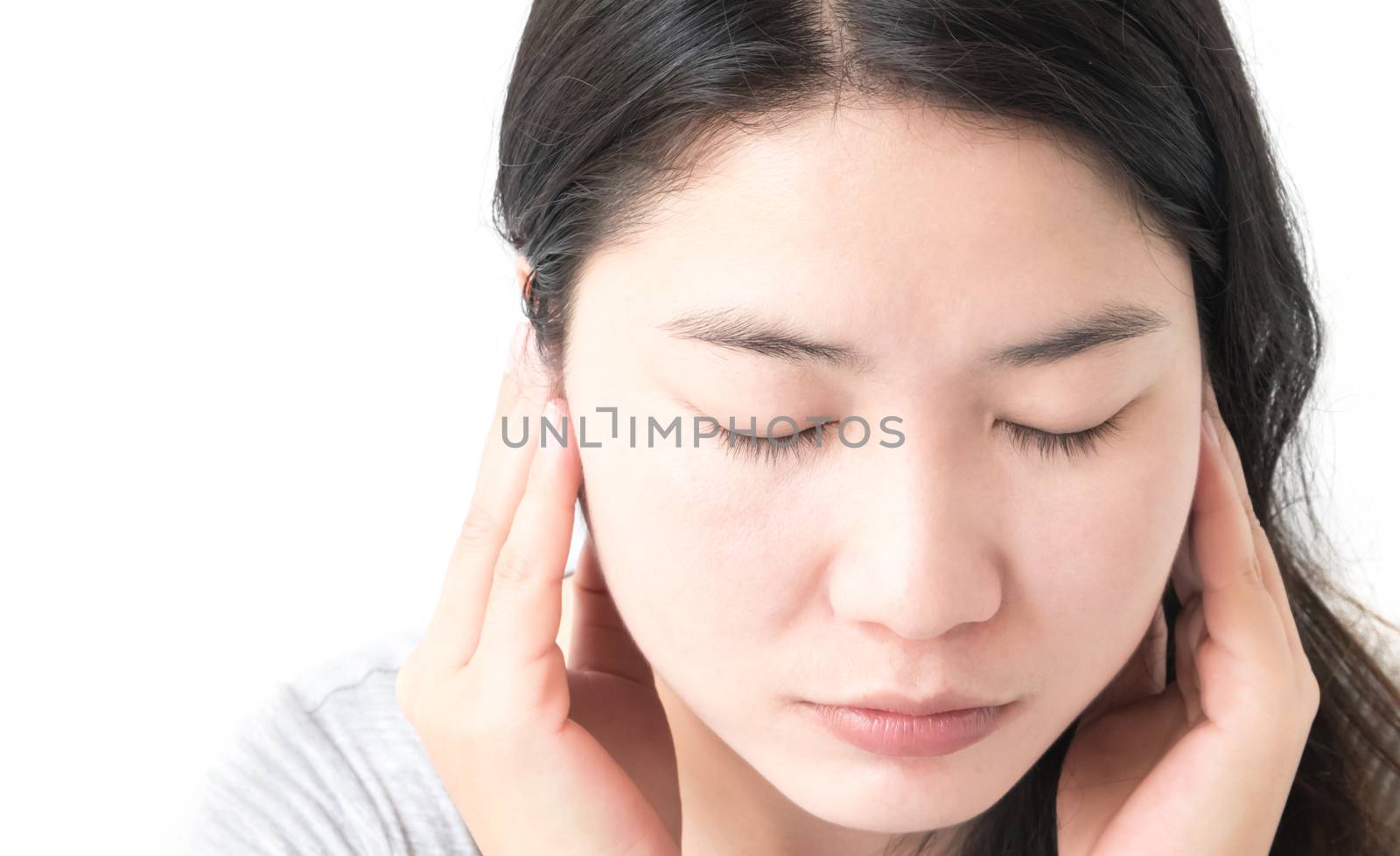 Closeup woman hand closes her ears with white background by pt.pongsak@gmail.com