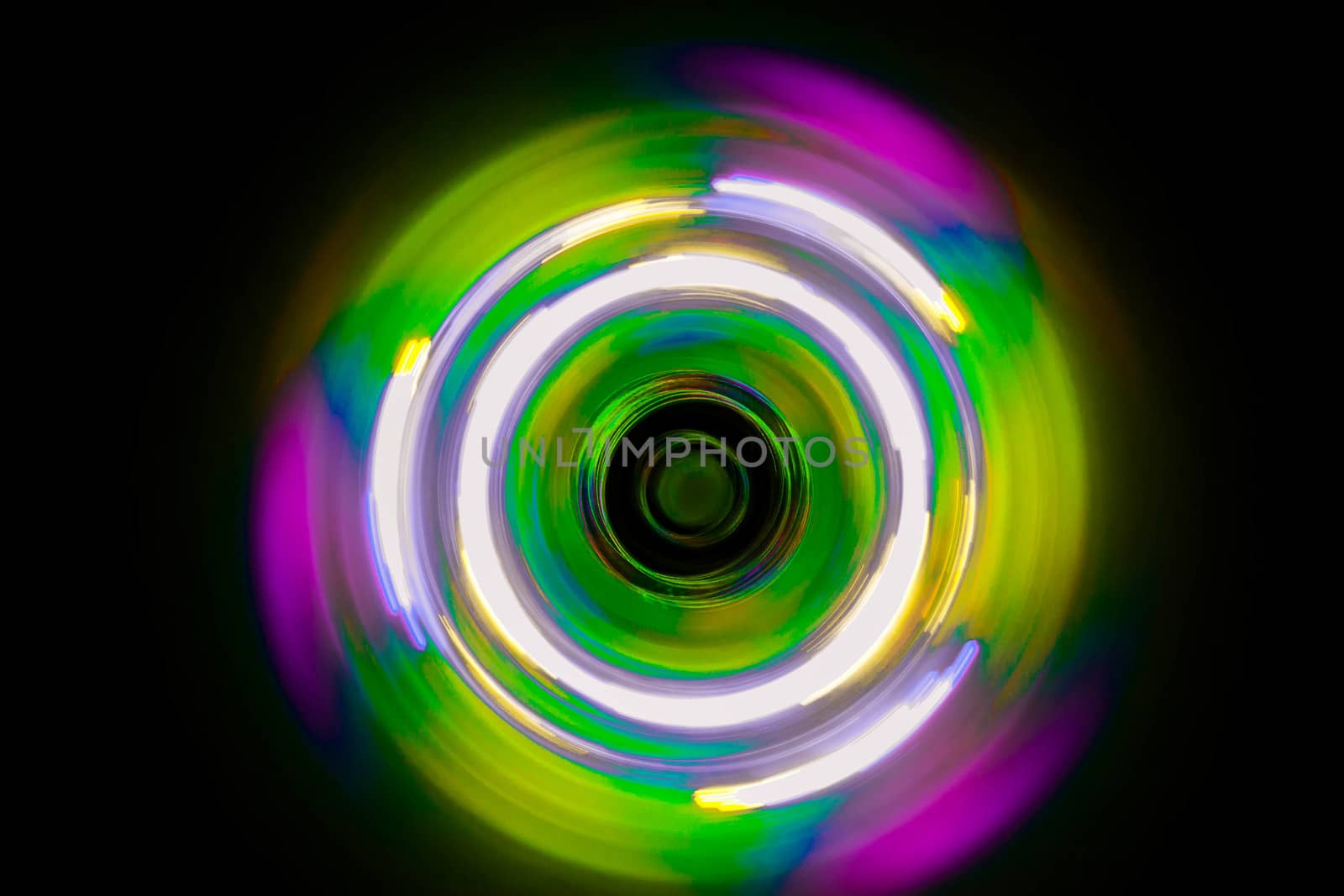 Colorful light neon circle in dark black background