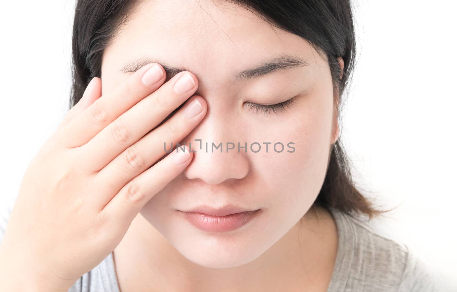 Woman hand closes eyes with eye pain, health care and medical concept