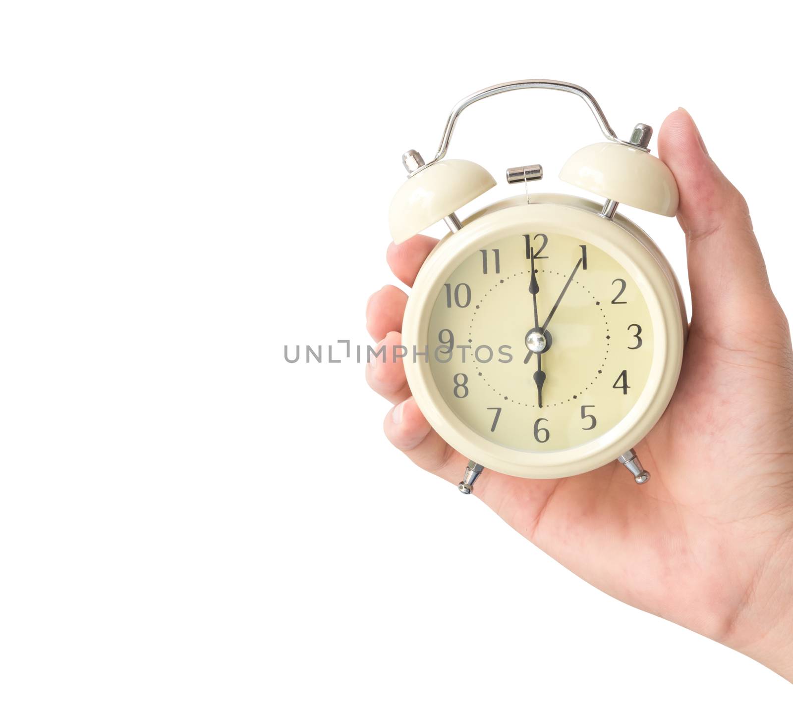 Hand holding retro alarm clock with white background