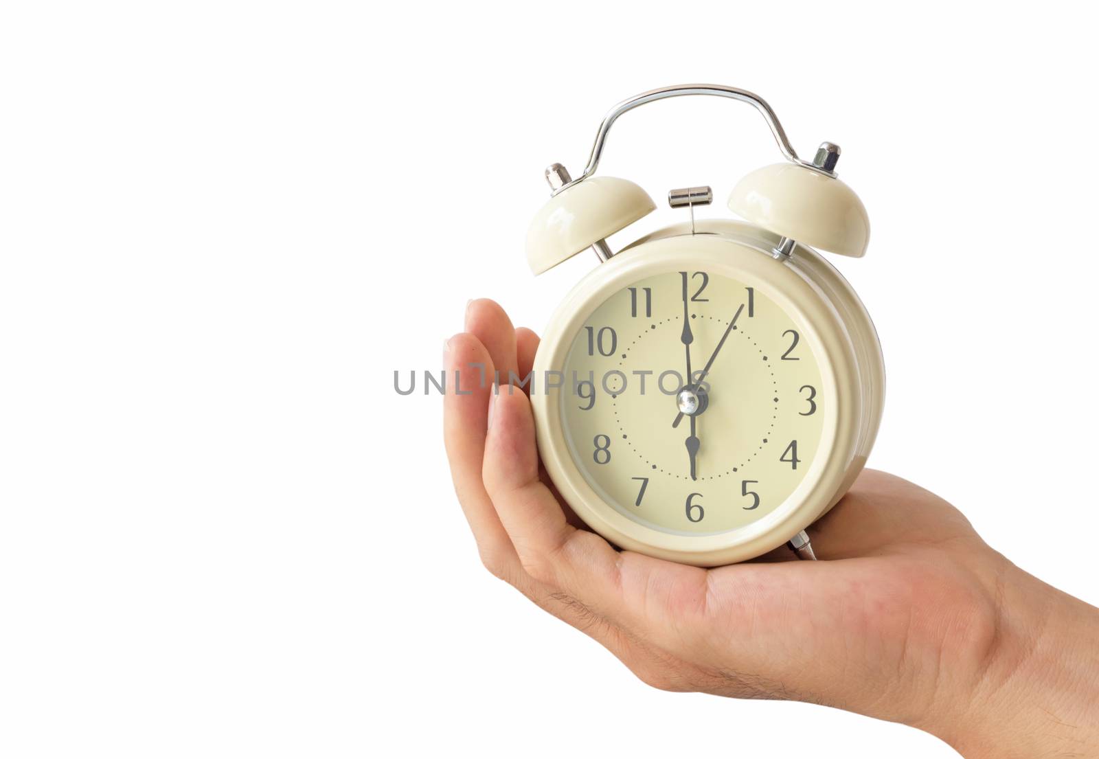 Hand holding retro alarm clock with white background by pt.pongsak@gmail.com