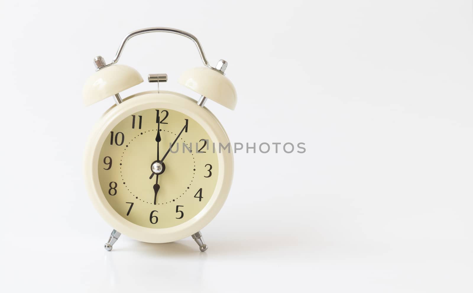 Retro color alarm clock on white background