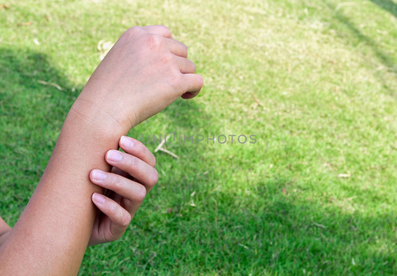 Woman with hand pain nature background, health care and medical  by pt.pongsak@gmail.com