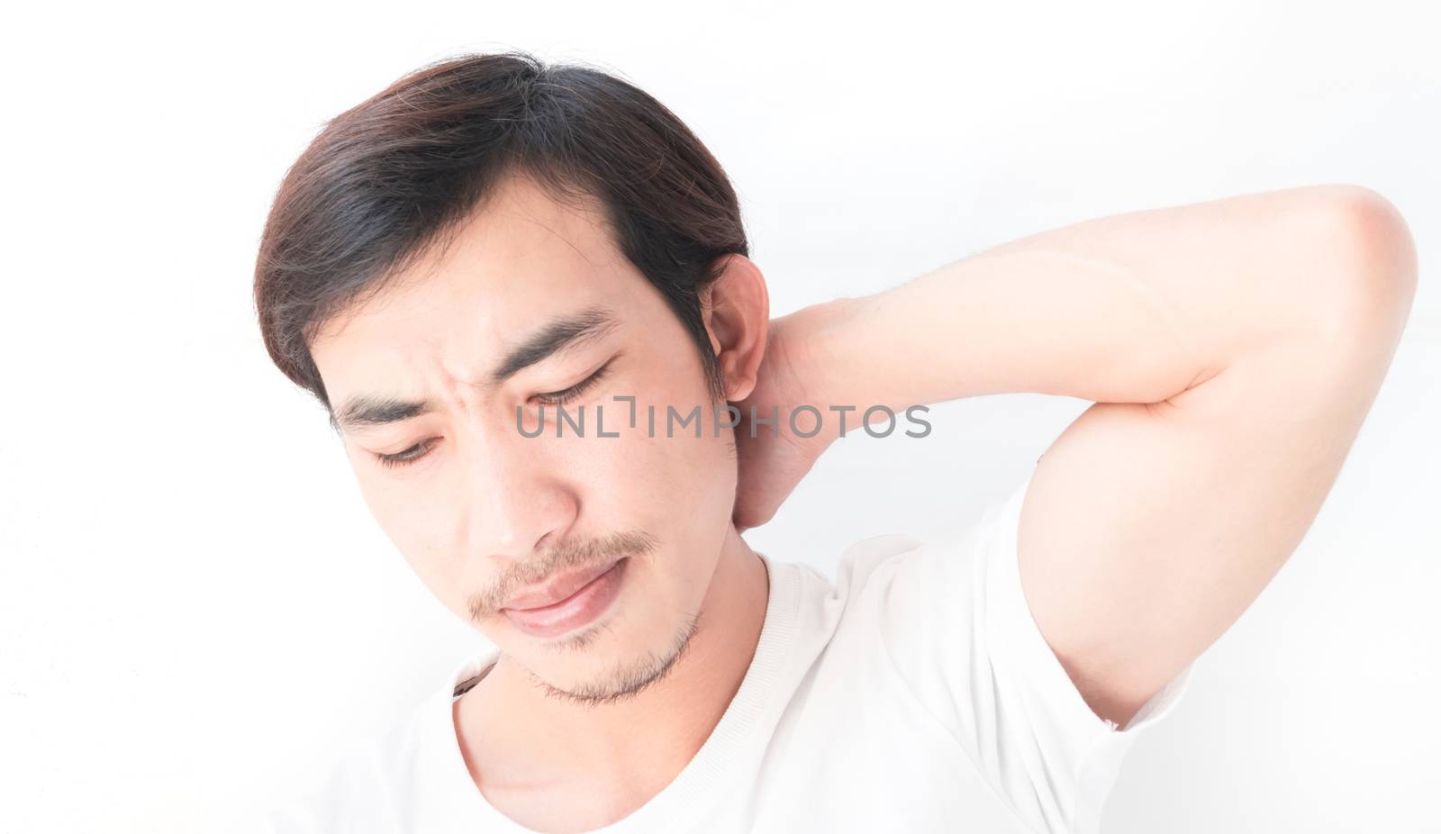 Closeup young man neck ache with white background