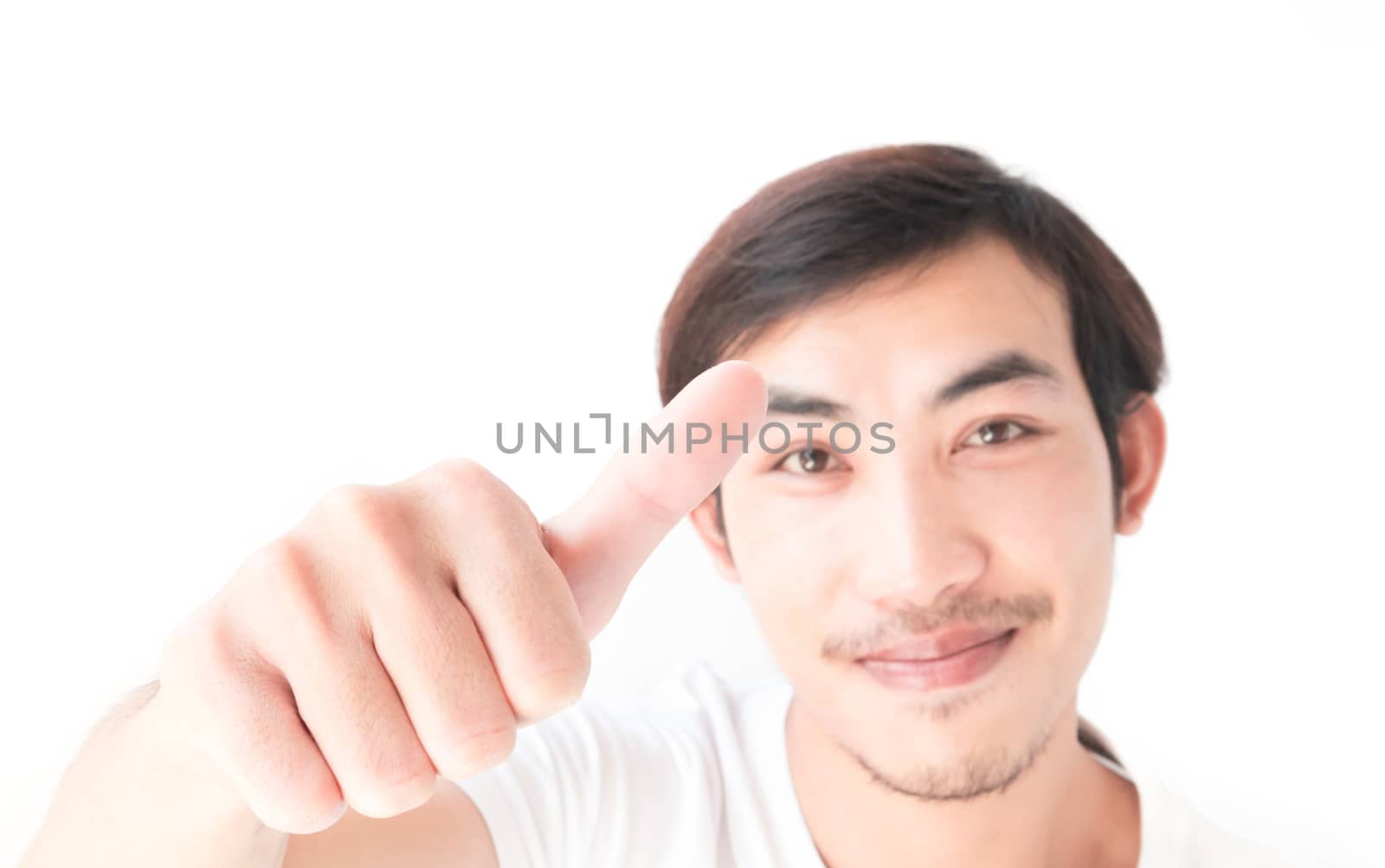 Closeup asian young man showing thumbs up with white background, by pt.pongsak@gmail.com