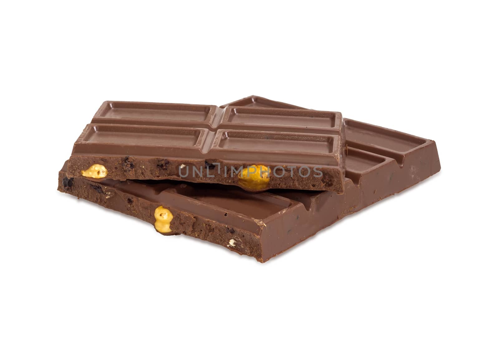 Pieces of the milk chocolate on a white background by anmbph