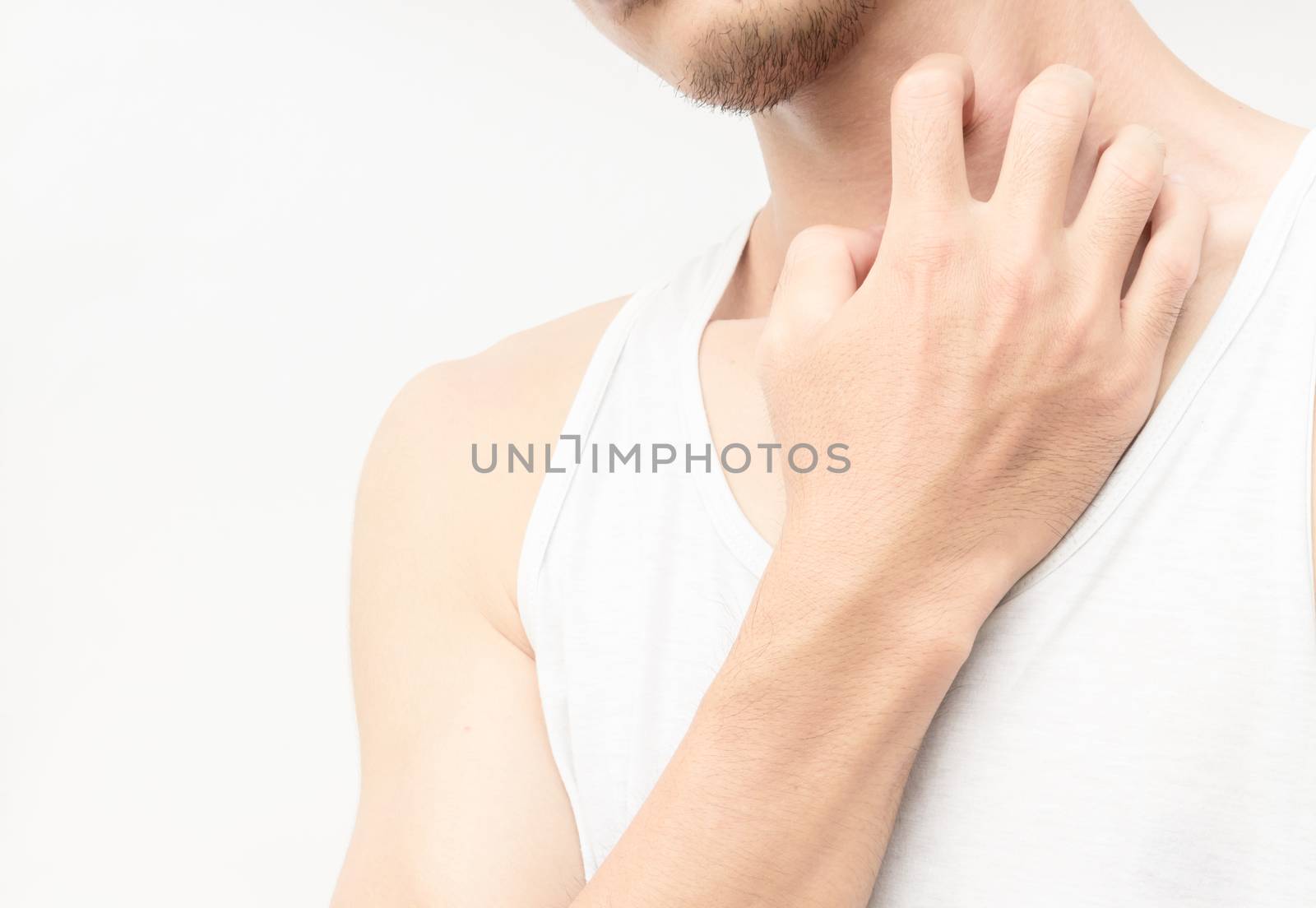Closeup young man scratch the itch on neck with white background by pt.pongsak@gmail.com