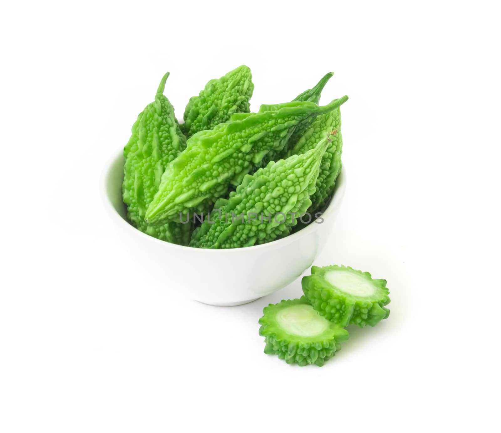 Bitter gourd in bowl on white background by pt.pongsak@gmail.com