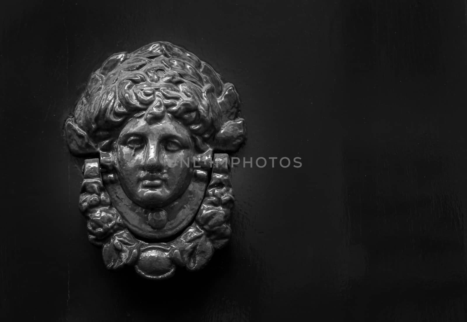 Close up of rustic old door in Florence, Italy.