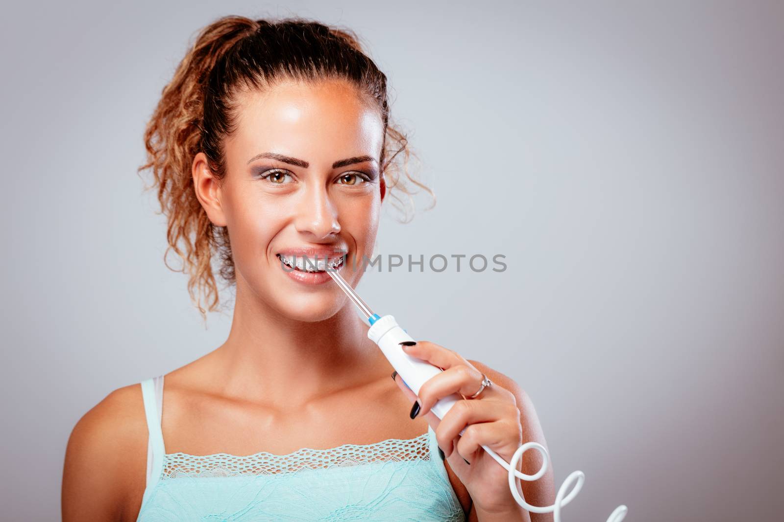 Brushing Teeth With Tooth Irrigator by MilanMarkovic78