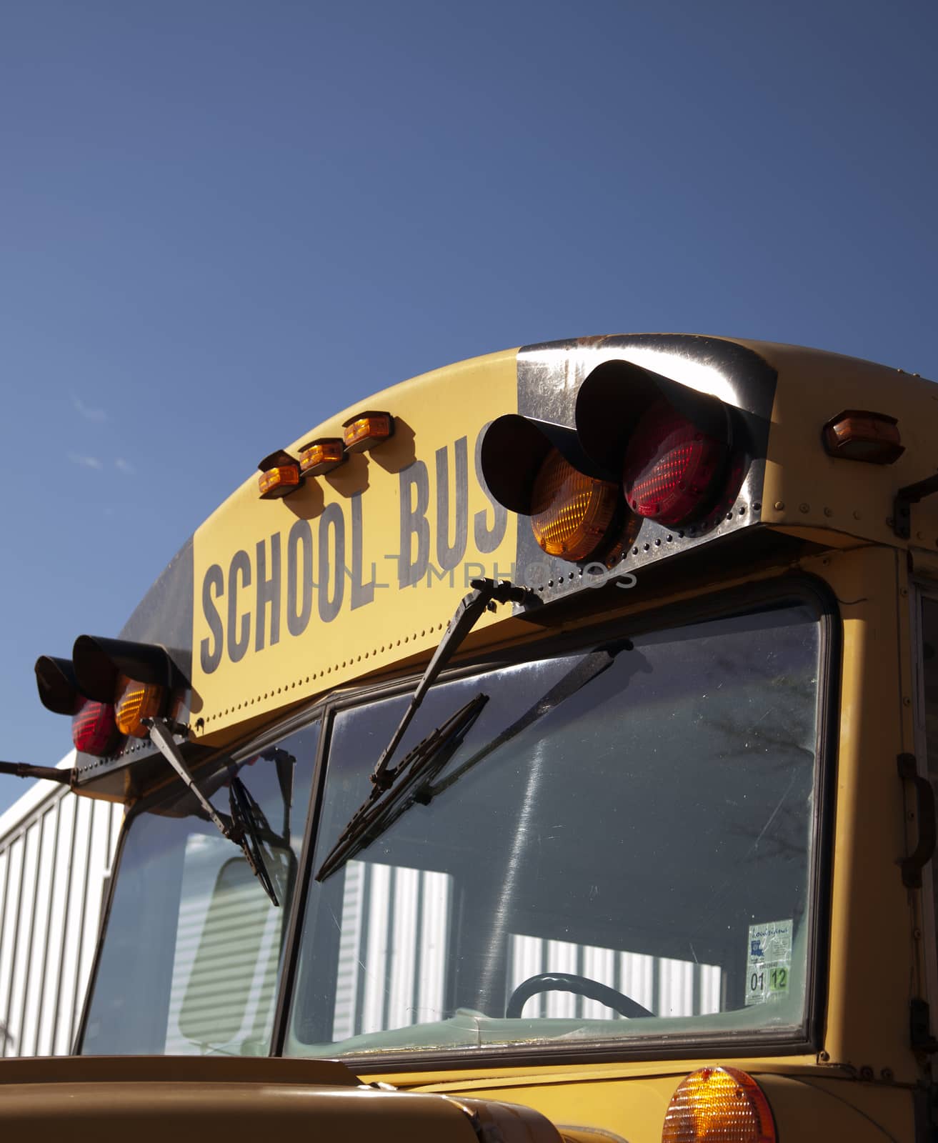 Close up of the front of a yellow school bus