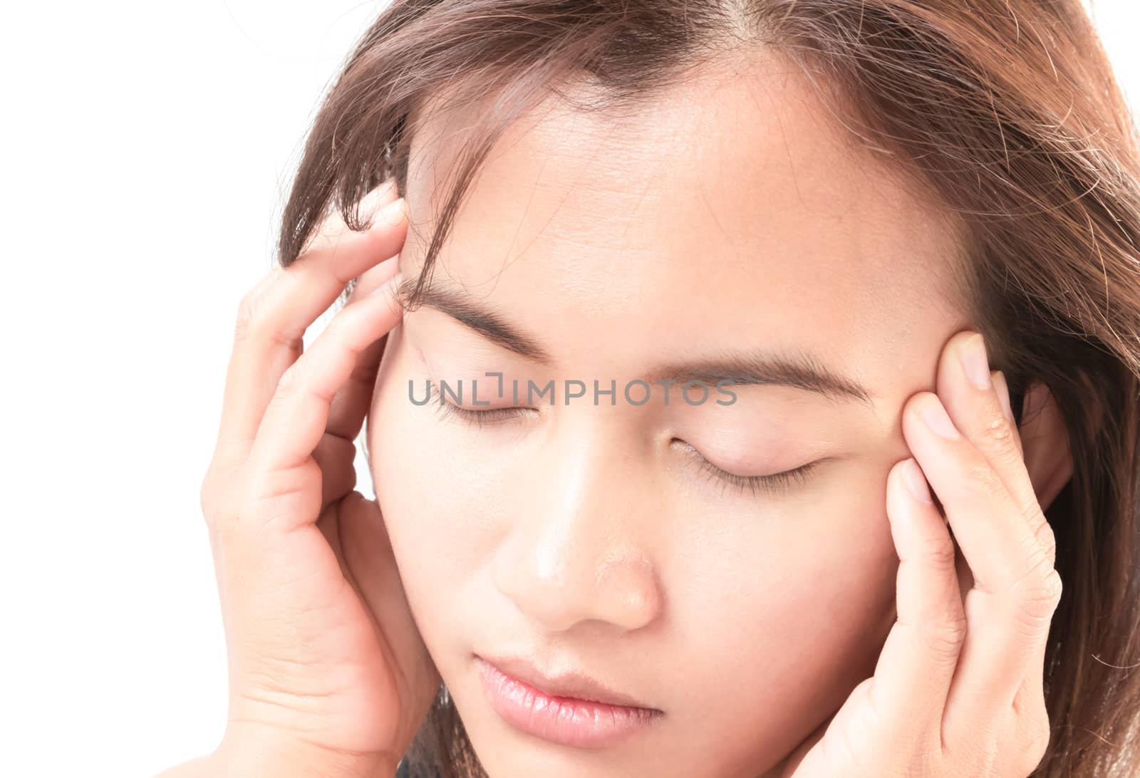 Closeup woman having headache with white background
