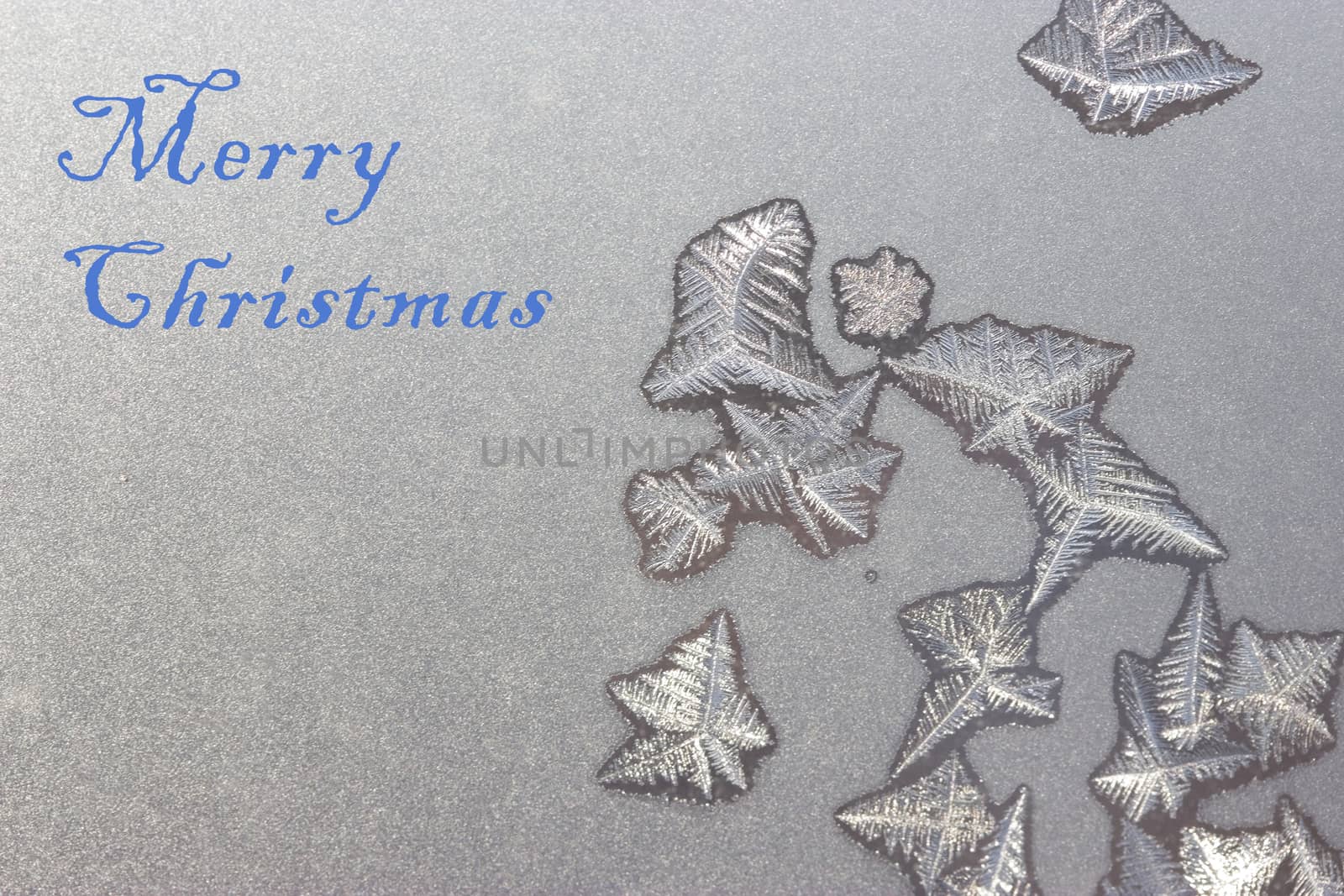 merry christmas concept. words written on frozen window