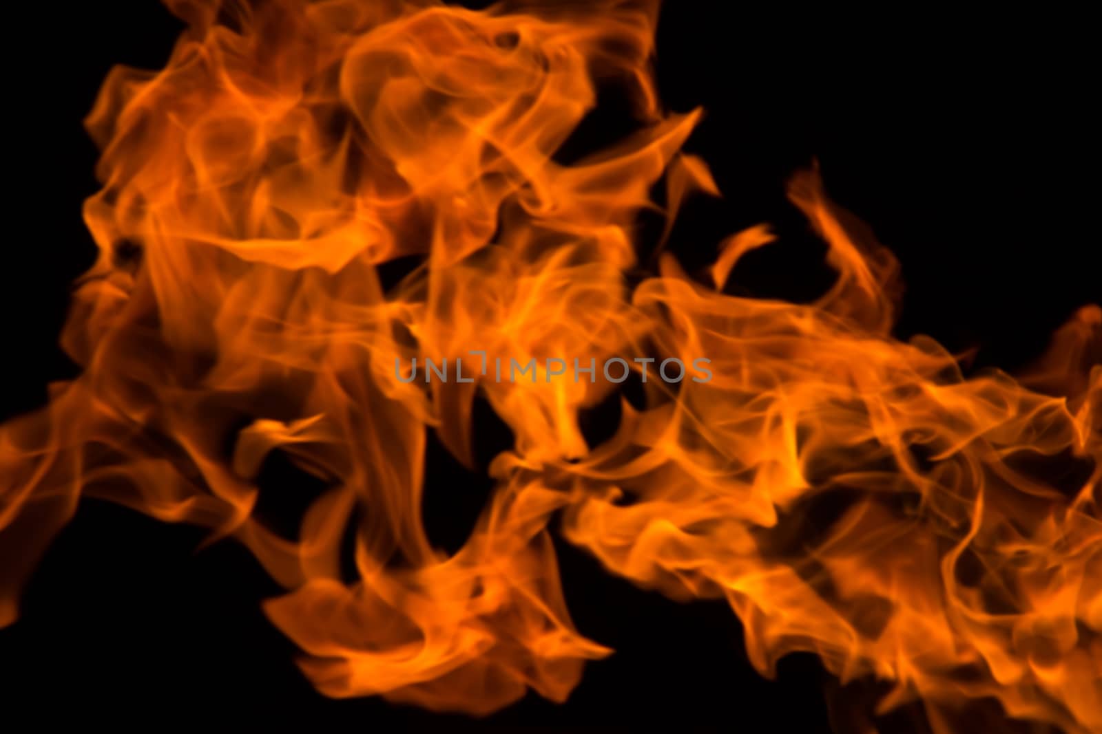 fire background blur in orange color.black background