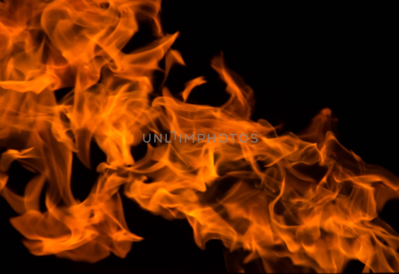 fire background blur in orange color.black background