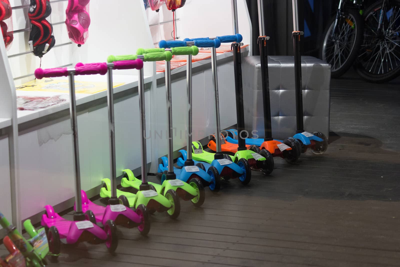 colorful kick scooters in the store window