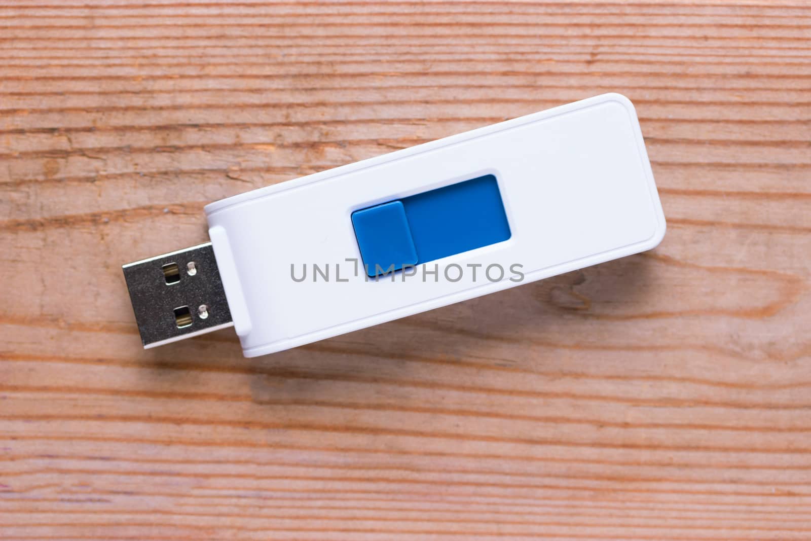 white flash drive mockup on wooden table